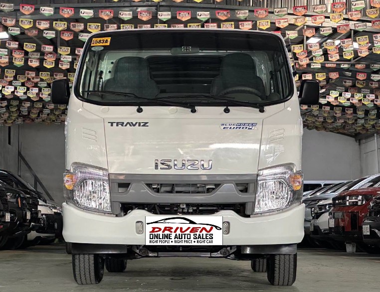 2025 ISUZU TRAVIZ L UTILITY VAN DUAL AC MANUAL DIESEL - Image 1